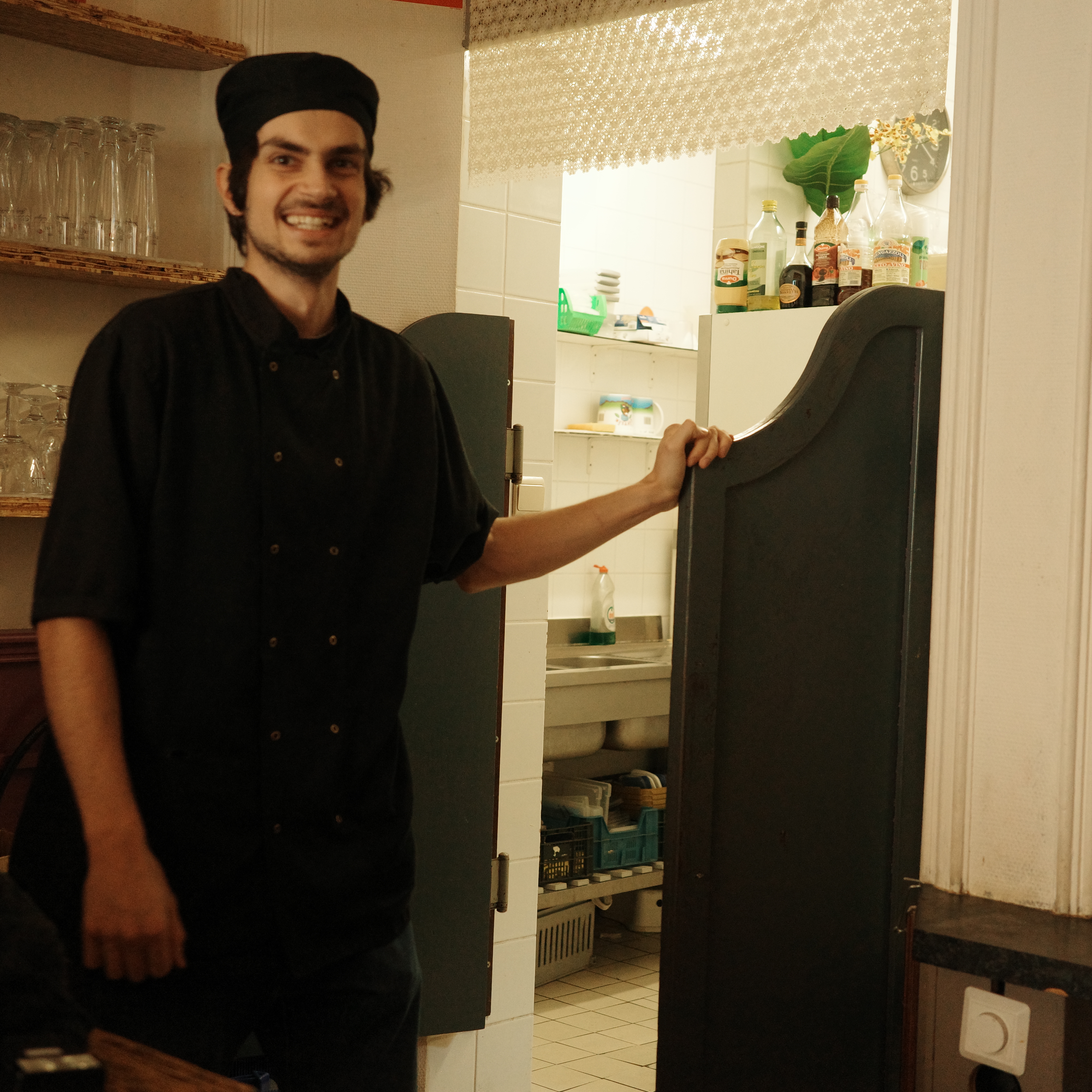 Goro chef in front of kitchen 